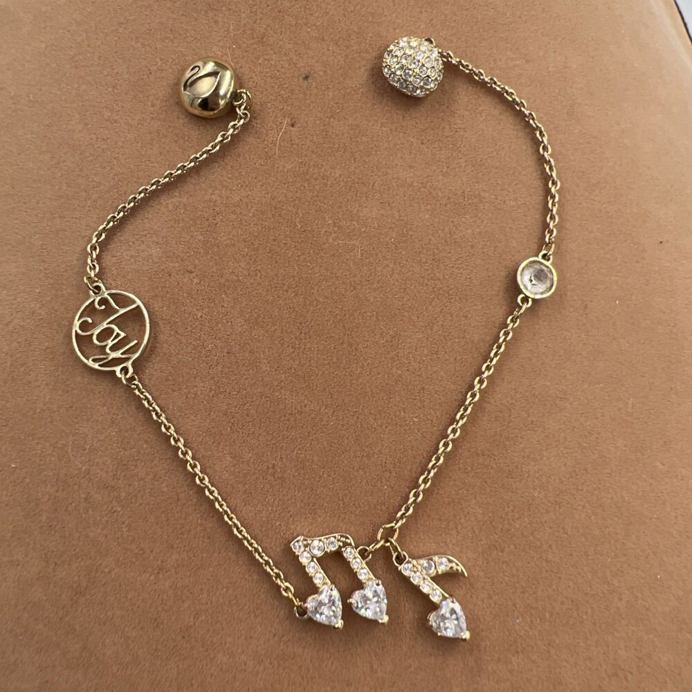 Swarovski remix collection strand gold plated bracelet 5512435 Music Notes JOY